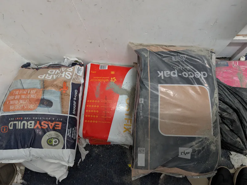 Cement, fillers, sealants and DIY repair products on a shop shelf